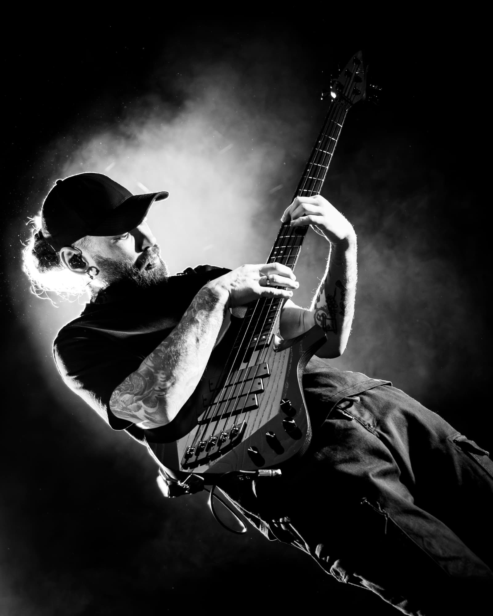 Jinjer bassist black and white portrait with smoke