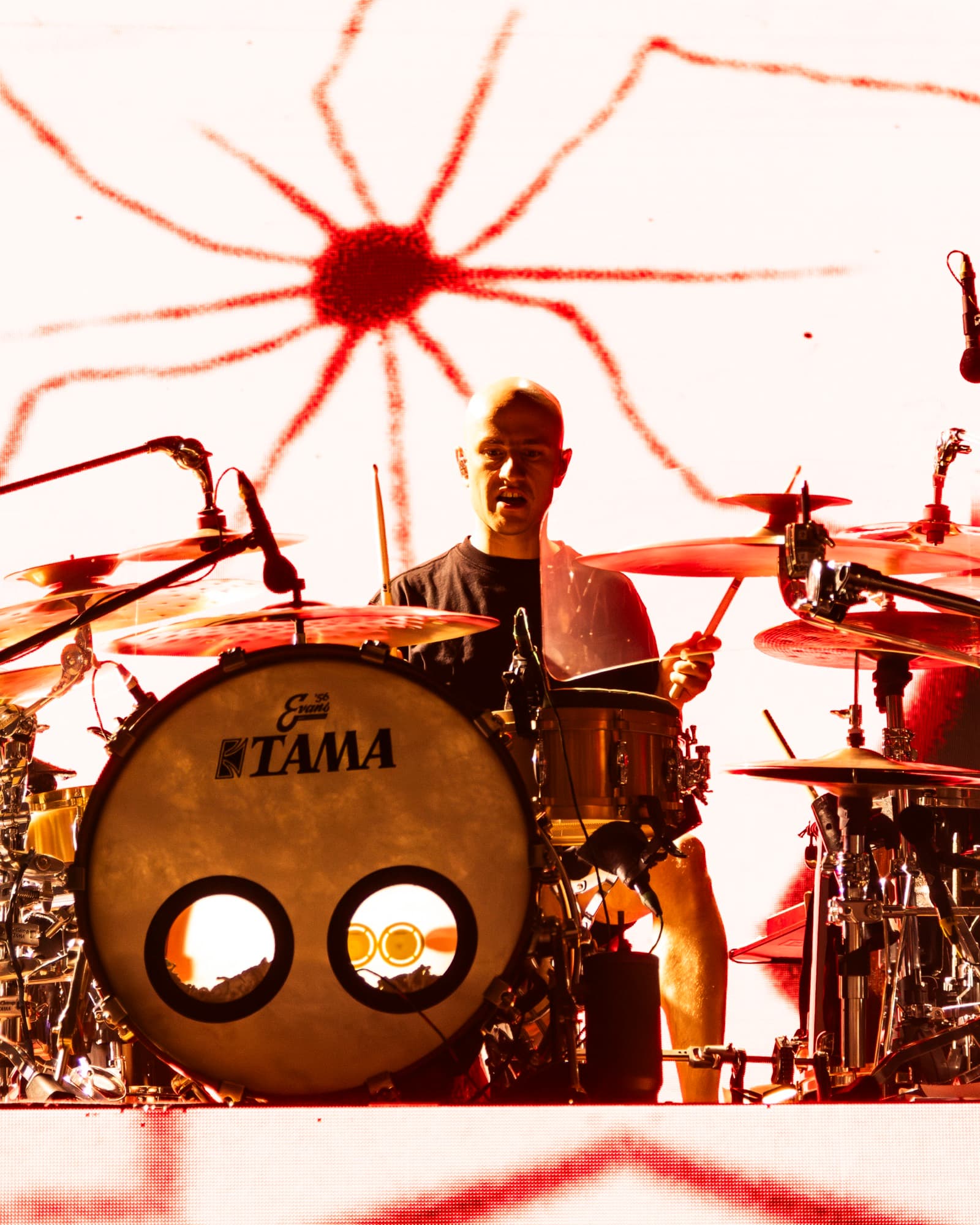 Jinjer drummer behind TAMA kit with spider visual