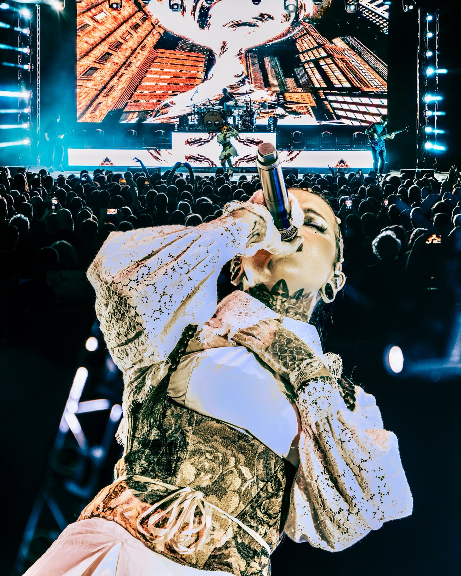 Jinjer vocalist performing with arena crowd